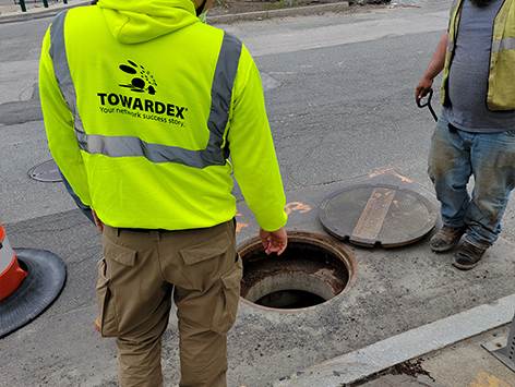 <b>Relocation of HEX manhole C19BA-203:</b>  Crews are inspecting the existing 2'x3'x2'D manhole for demolition.