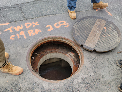 <b>Relocation of HEX manhole C19BA-203:</b>  Crews are inspecting the existing 2'x3'x2'D manhole for demolition.