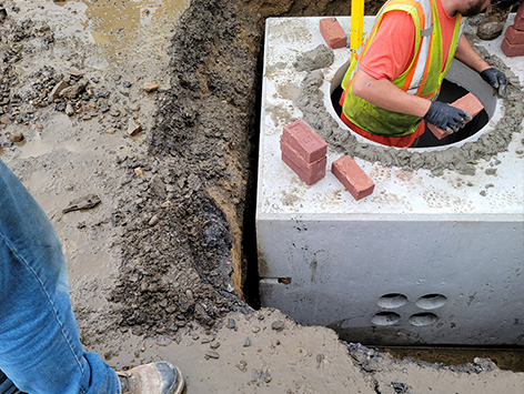 <b>Relocation of HEX manhole C19BA-203:</b>  Installing sewer bricks to accomodate future height adjustments for the new replacement manhole C19BA-203.