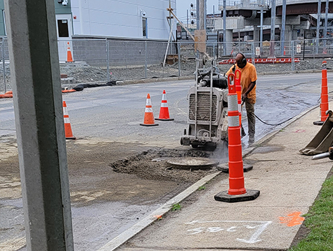 Sawcutting of the road surface for mainline duct bank which will mate with the newly relocated and replaced HEX manhole C19BA-203.