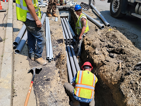 Installing (11) 4 inch ducts and (4) 1.25 inch ducts between HEX manholes C19BA-202 and relocated C19BA-203.