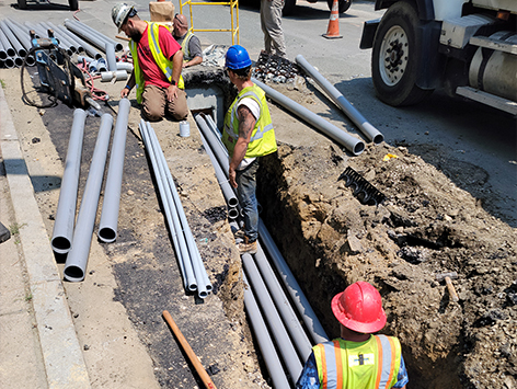 Installing (11) 4 inch ducts and (4) 1.25 inch ducts between HEX manholes C19BA-202 and relocated C19BA-203.