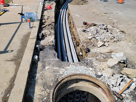 Mating of (11) 4 inch ducts and (4) 1.25 ducts from previously completed trench section to the newly relocated and replaced HEX manhole C19BA-203.