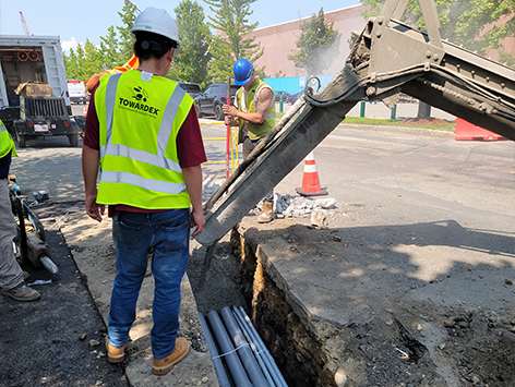 Encasing (11) 4 inch ducts and (4) 1.25 ducts between HEX manholes C19BA-202 and C19BA-203 with concrete.