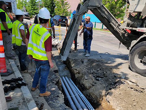 Encasing (11) 4 inch ducts and (4) 1.25 ducts between HEX manholes C19BA-202 and C19BA-203 with concrete.