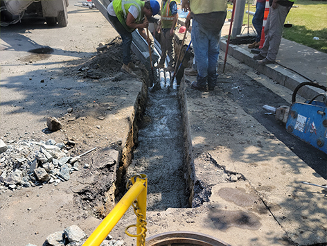 Encasing (11) 4 inch ducts and (4) 1.25 ducts between HEX manholes C19BA-202 and C19BA-203 with concrete.