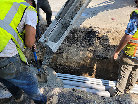 Encasing (11) 4 inch ducts and (4) 1.25 ducts between HEX manholes C19BA-202 and C19BA-203 with concrete.