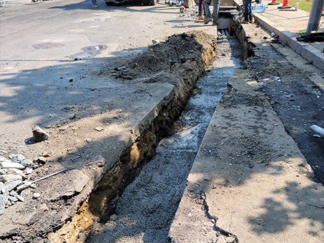 Encasing (11) 4 inch ducts and (4) 1.25 ducts between HEX manholes C19BA-202 and C19BA-203 with concrete.  MH C19BA-202 is visible at bottom and C19BA-203 is at top.