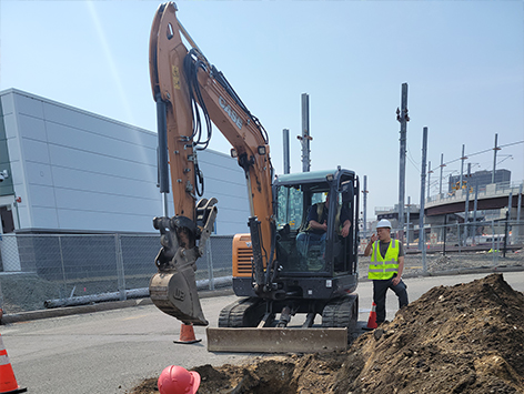 Project foreman and inspector from the project owner are discussing the running line for the mainline trench.