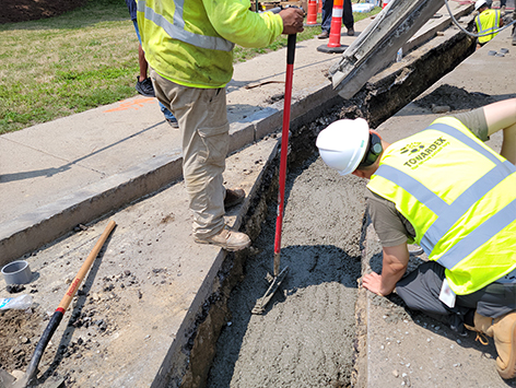 Backfilling of the completed mainline section with concrete.