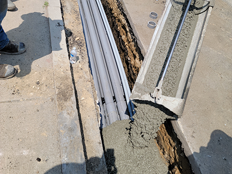 Backfilling of the completed mainline section with concrete.