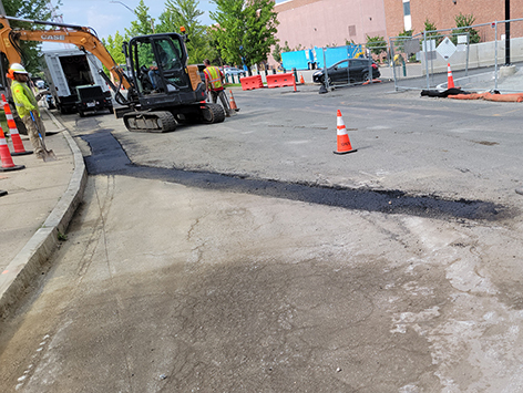 Completed pavement of the base binder layer for surface restoration.  Complete restoration with top coat is performed separately at the end of the project.